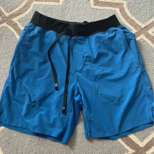 Men’s Fabletics shorts with inner compression shorts. Size M